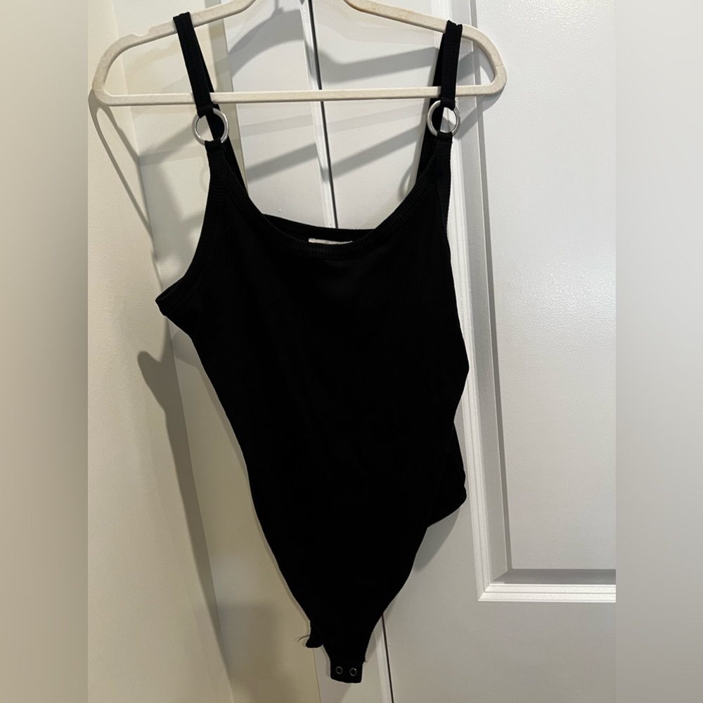 Express XL black body suit, silver rings on straps
